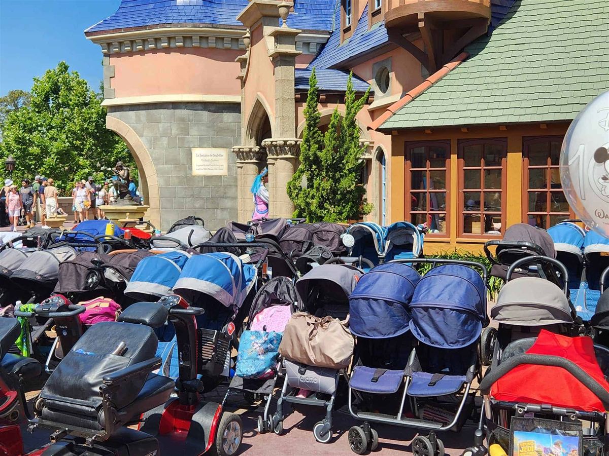 Rows of parked strollers outside Cinderella Castle at Magic Kingdom